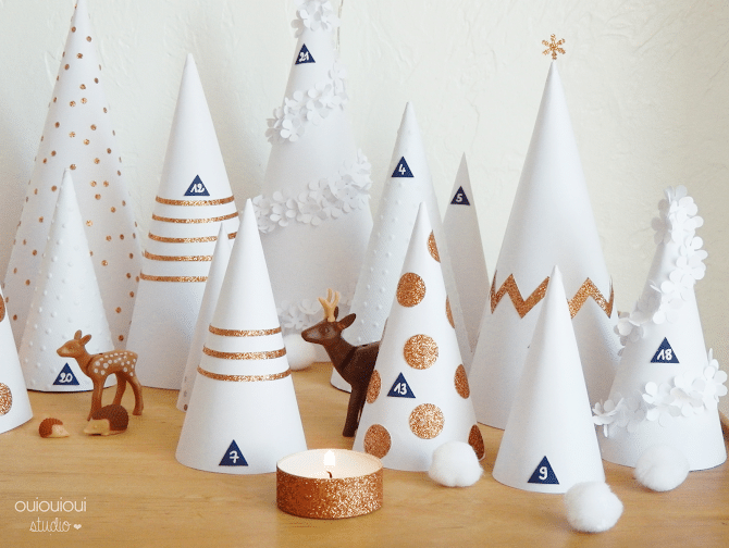 Advent calendar 2020 white cones decorated with fir trees