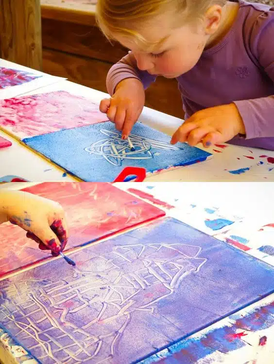 child's drawing : a little girl who draws with her fingers 