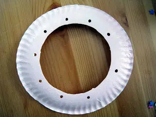 paper plate with a hole in the middle and around