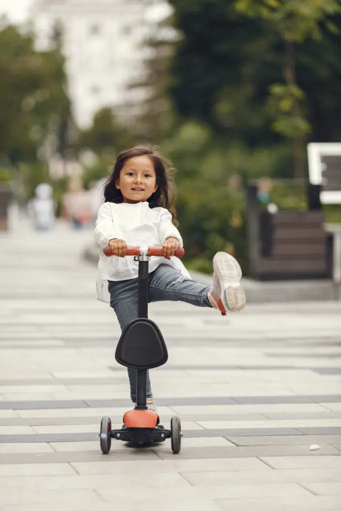 a girl having fun with her scooter 