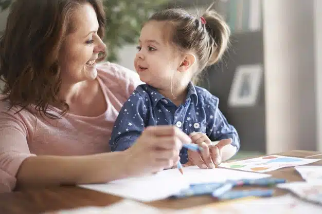 drawing child : a mother drawing with her little girl