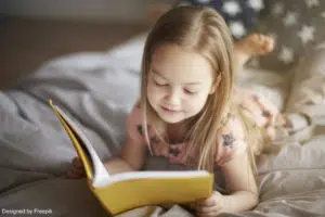 bedtime ritual: a girl reading a story