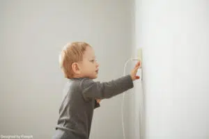 A child putting his fingers in a socket