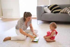 Regular babysitting: a nanny playing with a child 