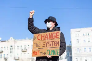 ecology definition: a man demonstrating for the planet.