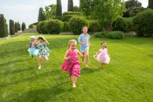 Children running in the grass
