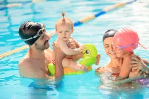 A family enjoying a pool vacation